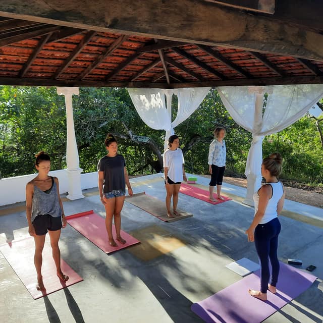 A morning class in the Yin Shala, between its white columns