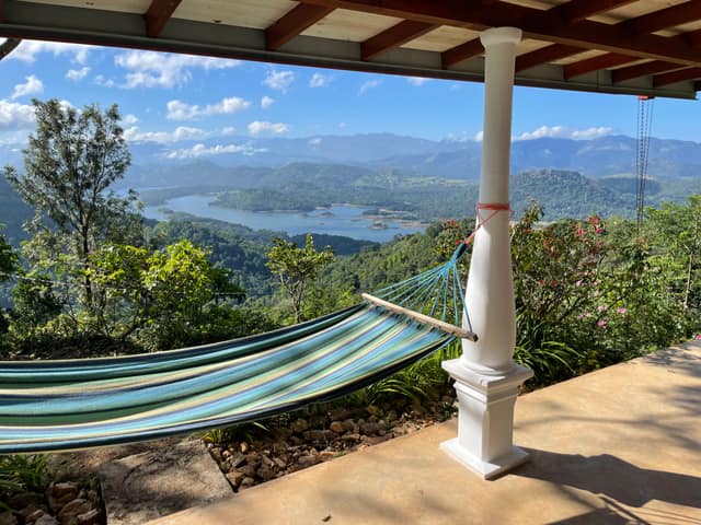 A hammock on the veranda, looking down to Victoria Lake
