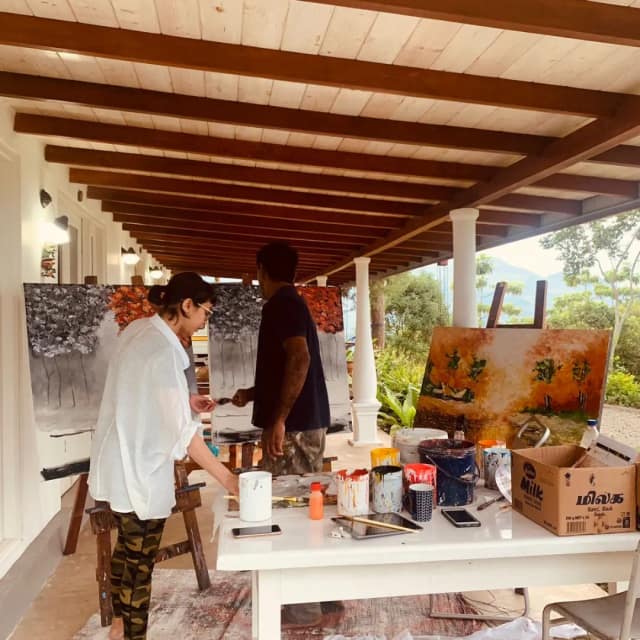 Painting on the veranda, easels set up between sessions