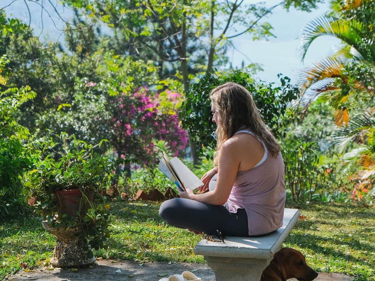 A guest reading in the estate garden