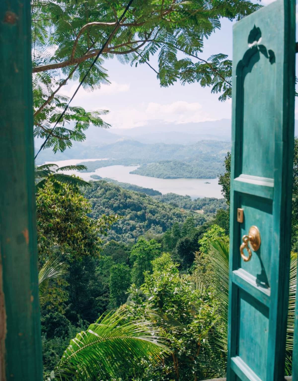 The turquoise door at Welikande, opening onto Victoria Lake and the Knuckles range
