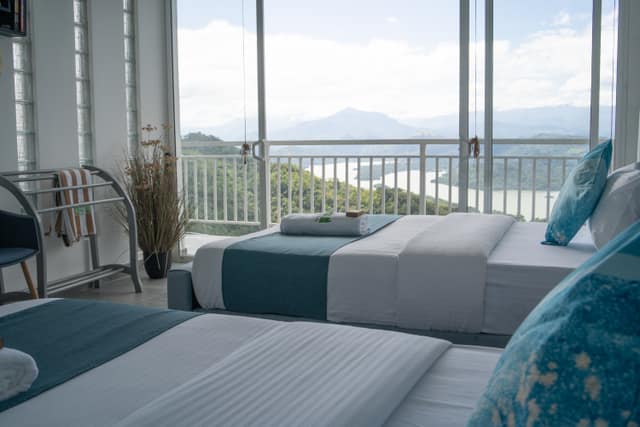 A Lake View room, the water visible from the bed