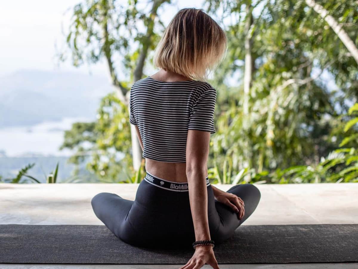 A guest sitting in meditation above the valley